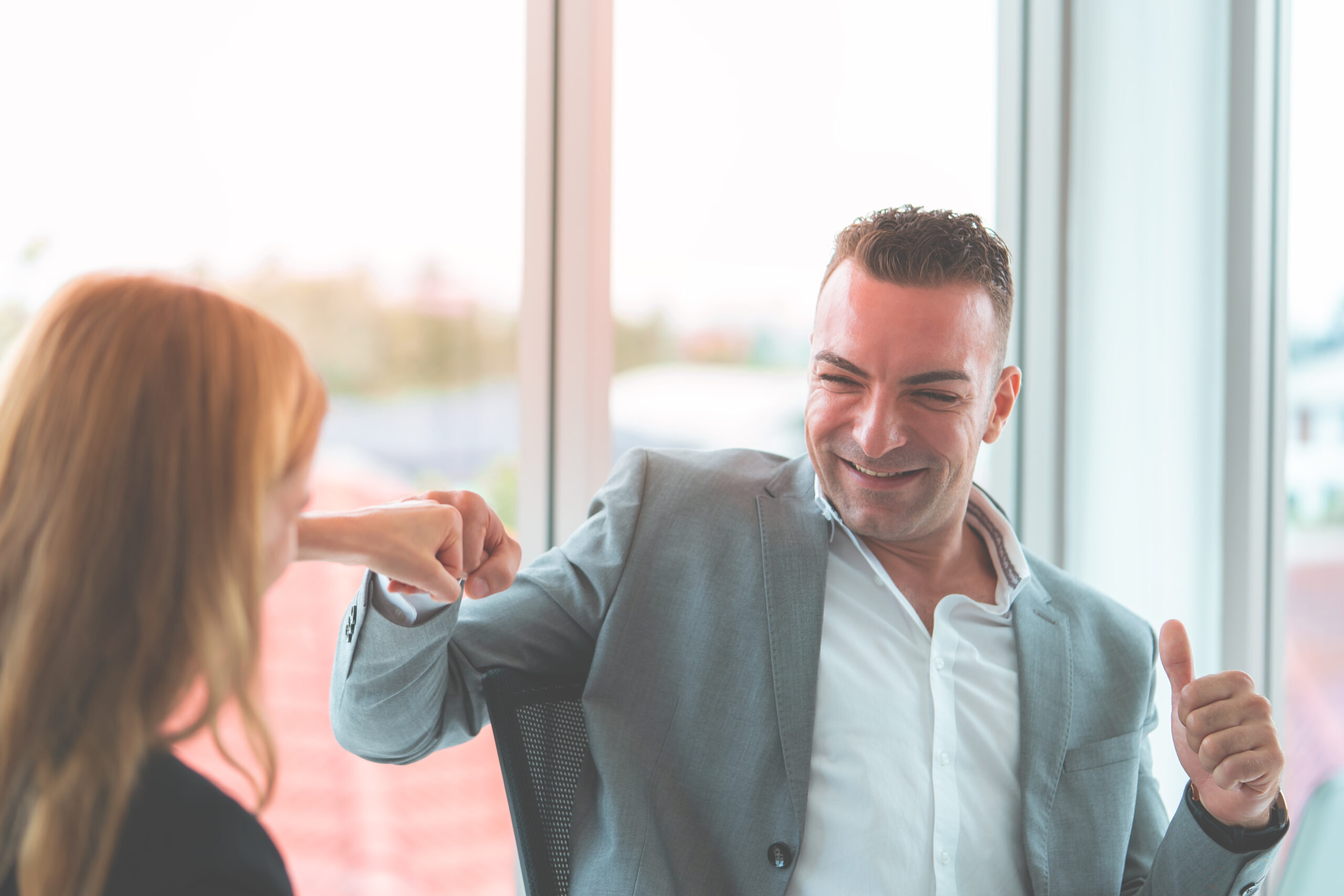 two digital marketing professionals celebrating